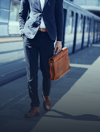 Man in blue suit waiting for subway car